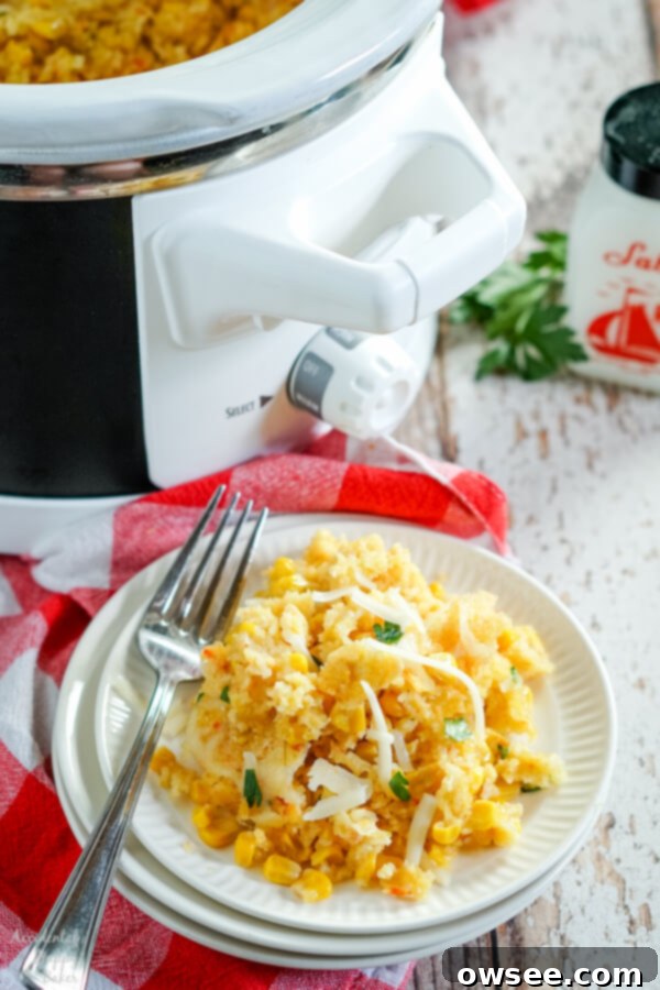 A generous serving of Crock Pot Corn Casserole, showcasing its creamy texture and golden-brown top, ready to be enjoyed as a perfect side dish.