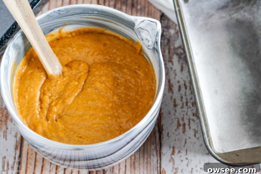 Mixing pumpkin bread batter