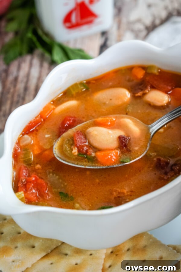 Old fashioned butter bean soup is full of hearty veggies and creamy butter beans in a smoky broth seasoned with bacon and cajun spices. #butterbeansoup #beansoup #beanandbaconsoup #accidentalhappybaker