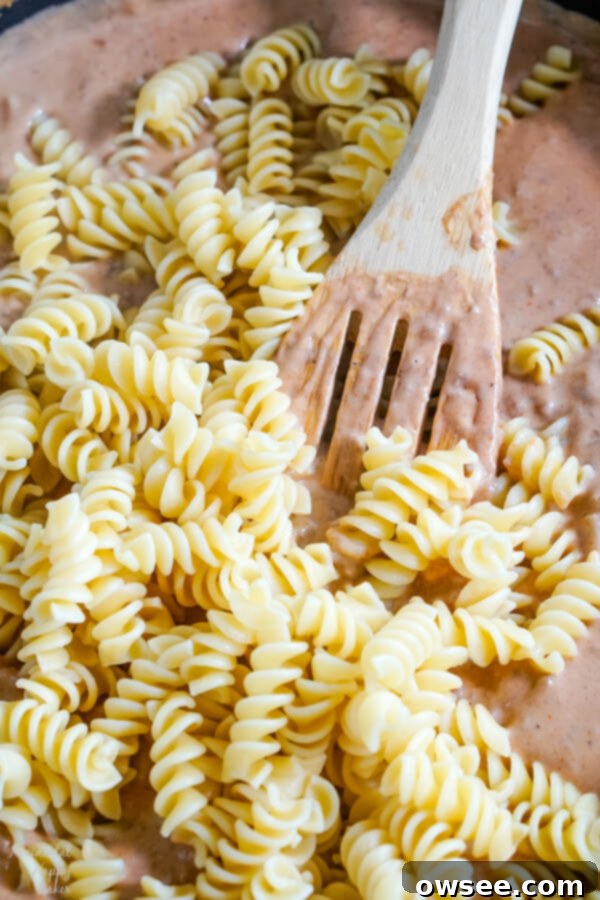 After the sauce is made, the cooked noodles are added.