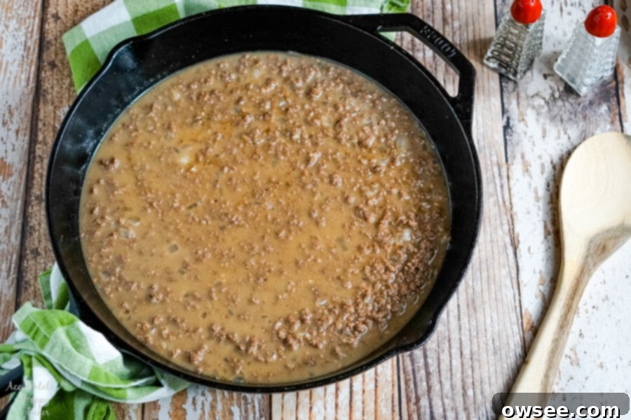 Shepherd's Pie with Tater Tots starts with ground beef in a gravy sauce. 