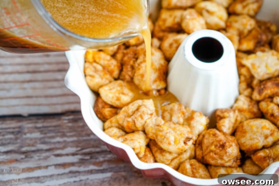 The orange syrup is poured over the biscuits in the bundt pan. 