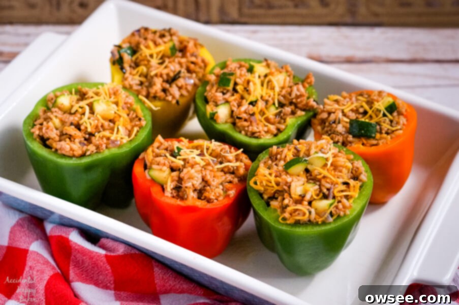 Prepared bell peppers, cored and ready for stuffing, laid out on a cutting board.