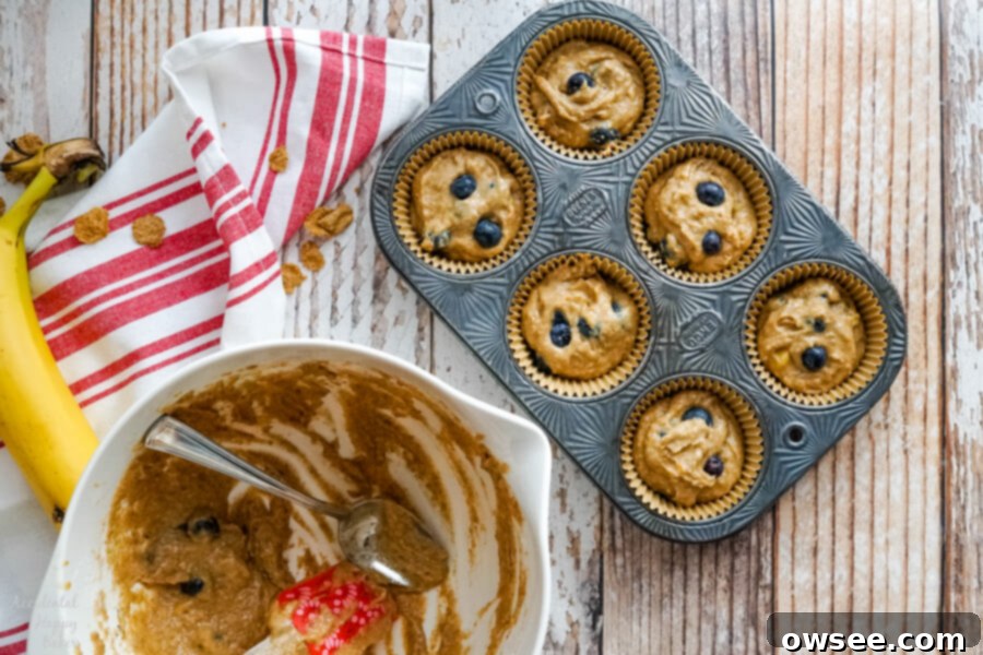 Wholesome Blueberry Bran Muffins 7 Freshly baked blueberry bran muffins, beautifully domed and golden, cooling on a wire rack, steam gently rising.