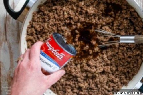 Ground beef mixture simmering in sauce.