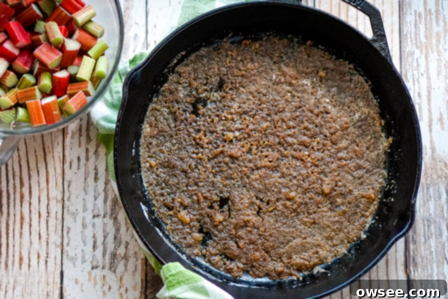 Spiced Rhubarb & Ginger Flip Cake 4 A cast iron skillet with melted butter, ginger and brown sugar, creating a delicious base for the cake.
