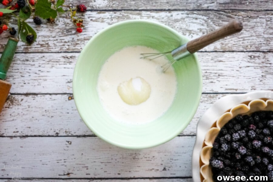 A green mixing bowl with the ingredients to make the filling for the pie. 