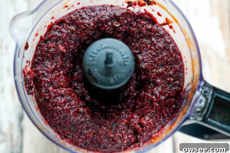 Artisan Blackberry Barbecue Sauce 5 The blackberry mixture after it is pureed in the food processor, a vibrant purple-red.