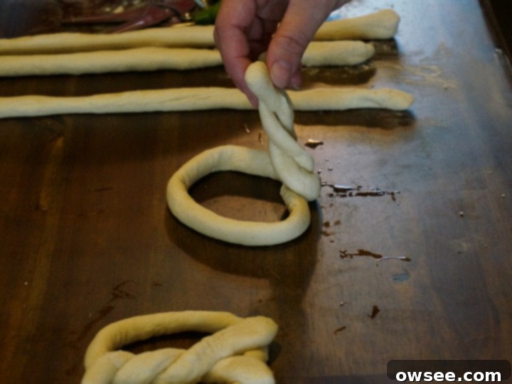 Baked Asiago cheese soft pretzels on a baking sheet