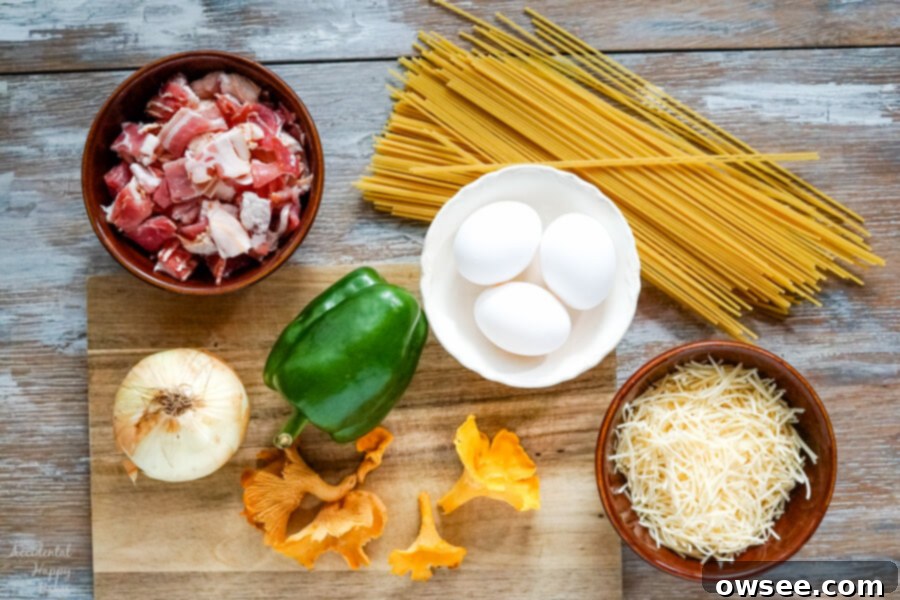 The ingredients for Spaghetti Carbonara laid out: crispy bacon, raw spaghetti, diced onion, chopped green bell pepper, sliced mushrooms, fresh eggs, and a block of Parmesan cheese.