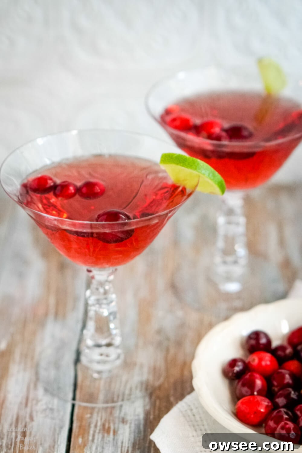Sparkling Cranberry Moscato Punch 7 Two crystal glasses of cranberry moscato punch.