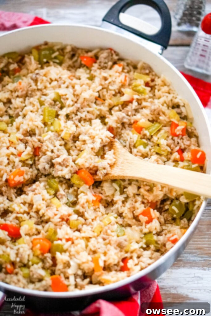 Savory Sausage Dirty Rice 6 Red and green bell peppers are added to the rice mixture next.