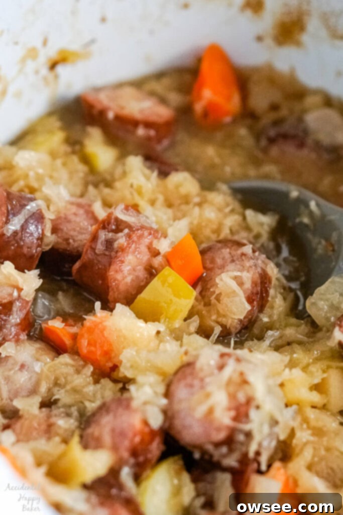 Hearty Slow Cooker Kielbasa and Sauerkraut Dinner 3 A close up image of the finished kielbasa and sauerkraut after it has finished cooking.