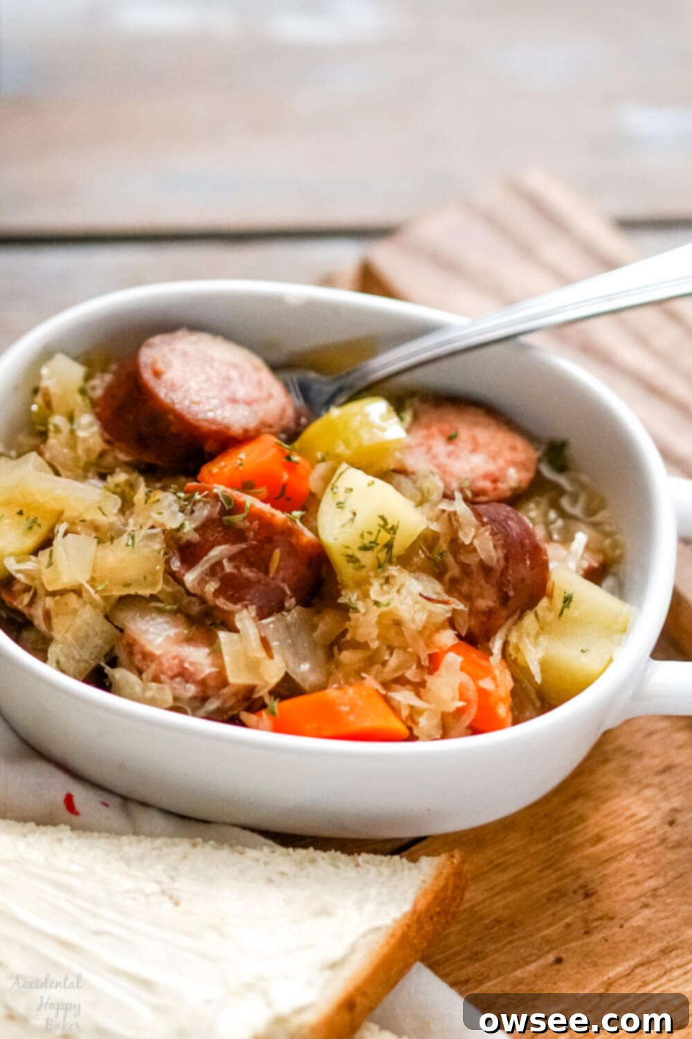 Hearty Slow Cooker Kielbasa and Sauerkraut Dinner 8 Kielbasa and sauerkraut are slow simmered with veggies, brown sugar, caraway and apple juice for a deliciously easy and comforting meal in the slow cooker.