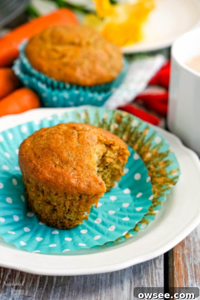 Wholesome Banana Carrot Muffins 4 Close-up of muffin batter in a mixing bowl, showcasing the combined wet and dry ingredients just before being scooped.