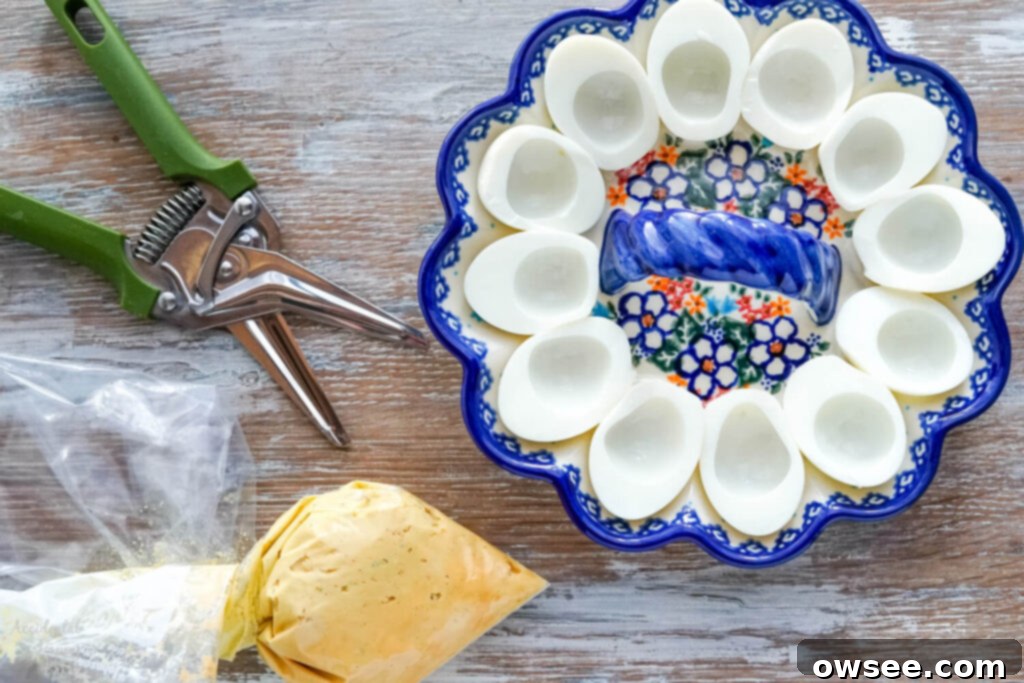 Filling ingredients in a Ziploc bag, and egg whites in a floral deviled egg dish. 