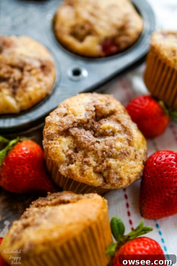 Zesty Lemon Blueberry Bread Drizzled with Buttermilk Glaze 6 A close up shot of a fluffy strawberry rhubarb muffin next to a muffin tin and some fresh strawberries. This muffin recipe also uses buttermilk for a tender crumb.