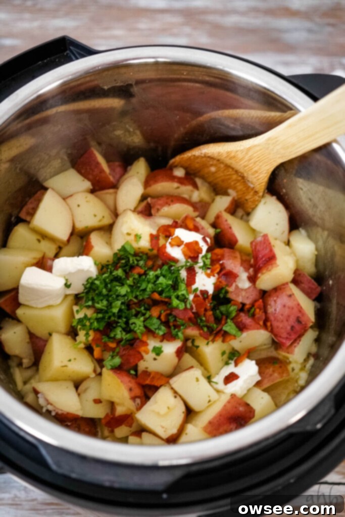 Creamy Instant Pot Ranch Potatoes 7 After cooking, the bacon, parsley and cream cheese are added to the instant pot.