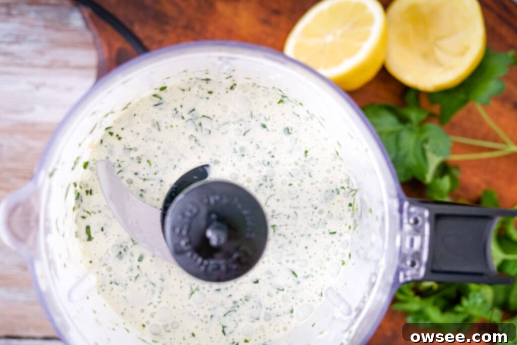 Creamy Mediterranean Tuna Salad 4 A food processor containing the perfectly blended creamy herbed lemon dressing, ready to be incorporated into the salad.