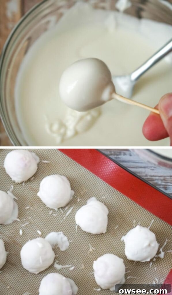 Easy Strawberry Cheesecake Truffles 8 Strawberry cheesecake truffles being dipped into melted white candy coating.