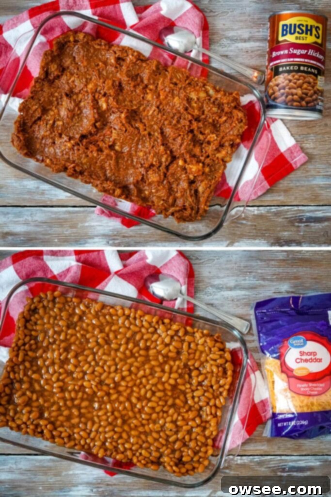 Loaded Pulled Pork Tater Tot Bake 3 The first layer of pulled pork mixed with barbecue sauce spread evenly in a baking dish, ready for the next step of the casserole.