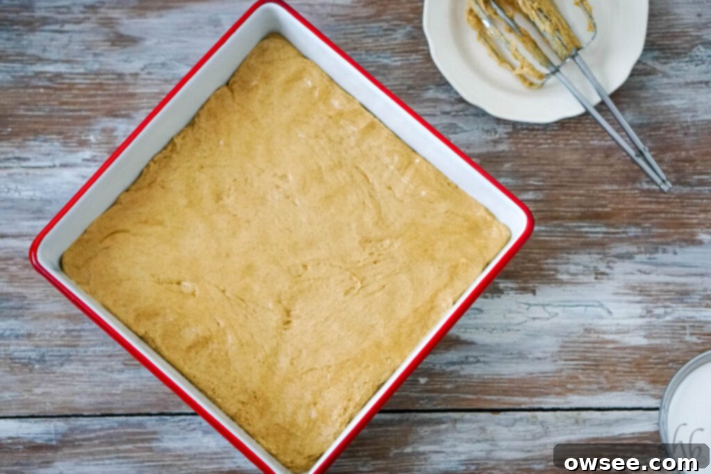 Churro Blondies 6 Step 2: Pressing the churro bar dough evenly into a 9x9 inch baking pan.