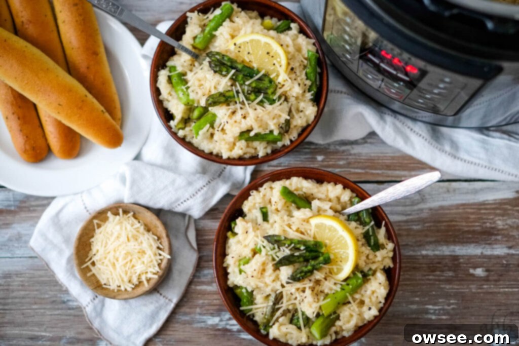 Creamy Instant Pot Asparagus Risotto 3 Close-up of creamy Instant Pot Asparagus Risotto in a pan with a serving spoon.