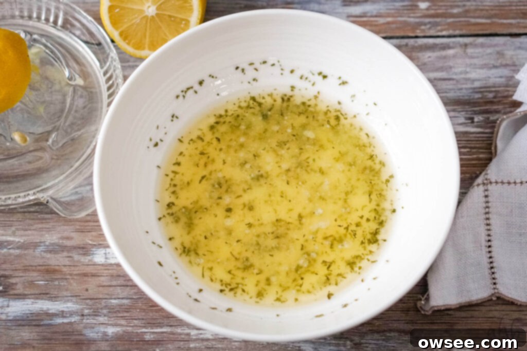 Crispy Air Fryer Scallops 8 Minced garlic, melted butter, and fresh parsley are combined in a small bowl to create the aromatic garlic butter sauce.