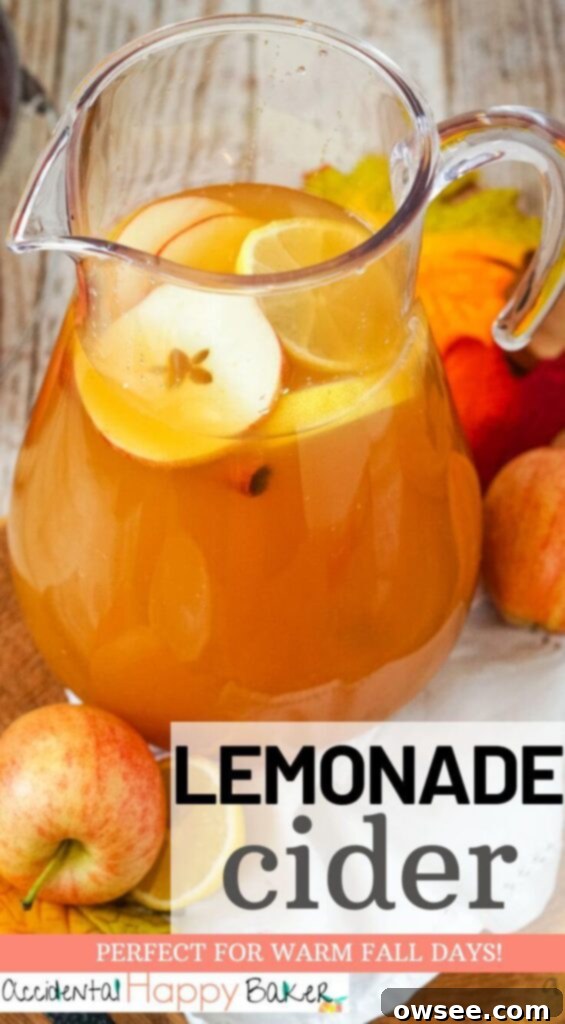 Sunburst Cider 7 A beautifully composed flat lay image showcasing a glass of Lemonade Cider, garnished with a lemon slice, apple slice, and cinnamon stick, accompanied by whole apples and citrus, inviting viewers to save the recipe on Pinterest.